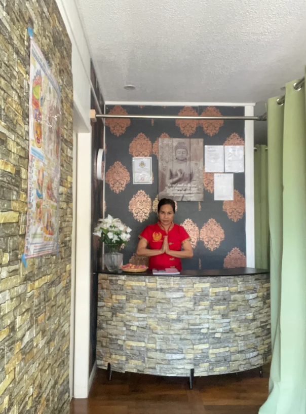 Kanok at the reception desk